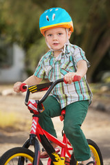 Obraz premium Child in Bike Helmet Riding