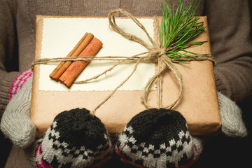 Christmas gift wrapped in vintage. In hand