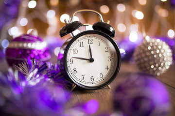 Vintage clock with Christmas decorations and lights