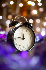 Vintage clock with Christmas decorations and lights