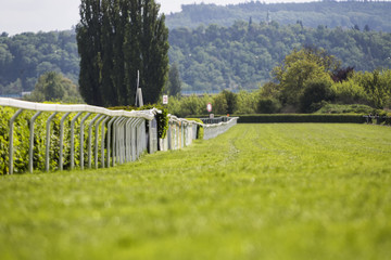 Empty race track for horses, blurred background