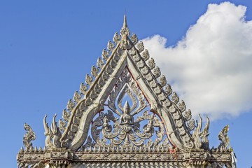 Fototapeta premium Beautiful Arch gable in Thai style - triangle on door in Thailand Temple 