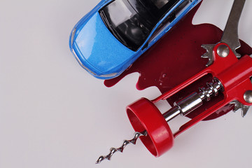 Don't drink and drive concept. opener for wine bottles an stain red of wine.  Responsibly and safety driving