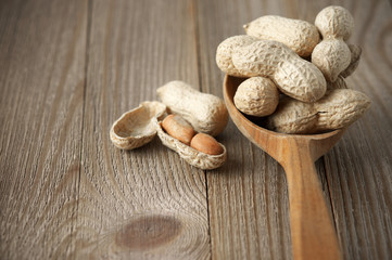 Peanuts in wooden spoon