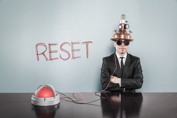 Reset concept with vintage businessman and calculator - obrazy, fototapety, plakaty