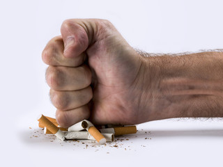 Human hand crushed some cigarettes