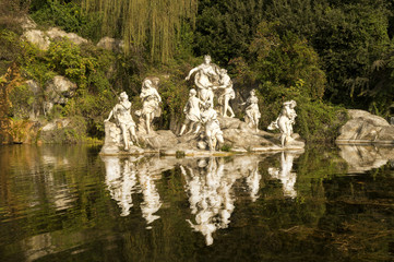 Fototapeta na wymiar Caserta Royal Palace ,statues and reflections in the gardens of the Palace, Italy