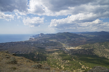 Panorama of a small resort town in Crimea from the top of the mo
