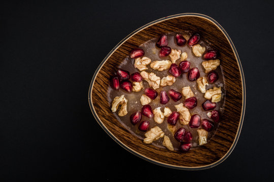 Traditional Turkish Dessert Ashura  on Dark Wooden Background
