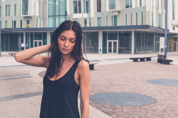 Fototapeta premium Beautiful girl posing in an urban context