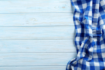 Napkin on blue wooden table, close up