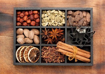 spices, seasonings, spicy. Christmas baking ingredients in a wooden box. Top view