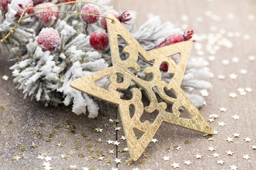 Christmas decoration with fir branches on the wood background.
