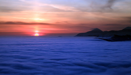 Fototapeta premium Peaks above clouds