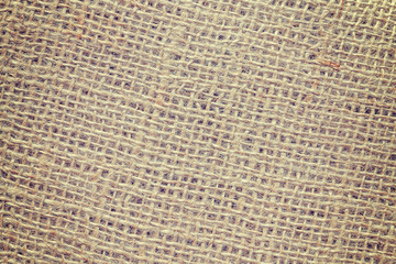 Vintage toned high quality close up picture of jute fabric.