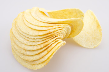Potato chips on white background