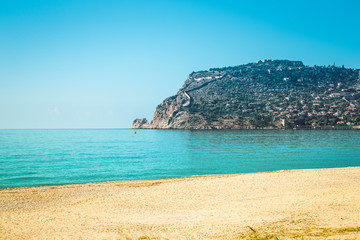 Stony beach and beautifull view to ancient fortress on the Alany