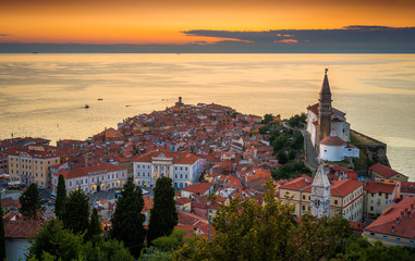 Sunset Over Adriatic Sea and Picturesque Old Town of Piran, Slovenia. Aerial View.