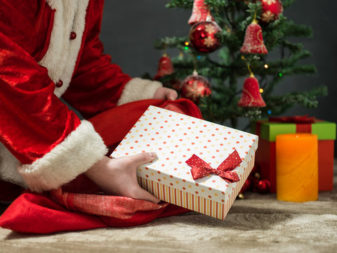 holidays, celebration and people concept - close up of santa cla