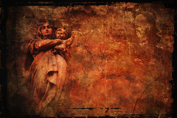 a statue of the Madonna and Child on the grunge background