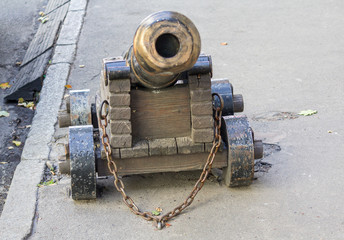 Ancient cannon riveted to the pavement