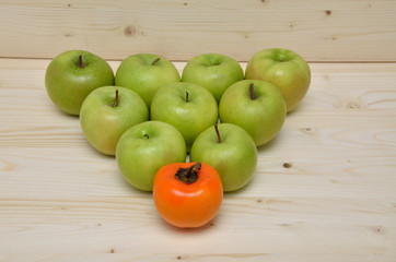 Green apples and orange kaki apple