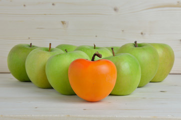 Orange, kaki, apple and green apples