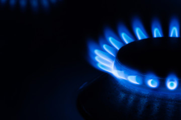 Close up of a gas burner fire on black background 