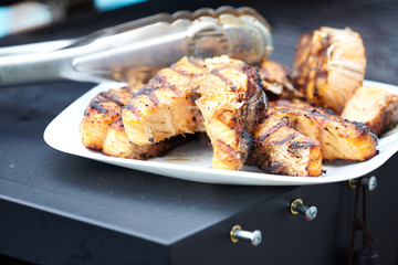Salmon fish roasted on barbecue grill.