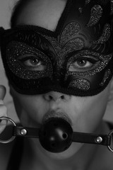 woman with mask and ball gag