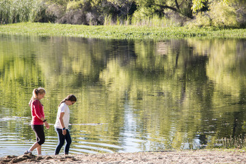 Girls Walking on Lake Shore
