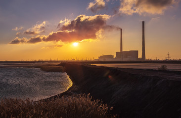 thermal power plant ash lagoon at sunrise