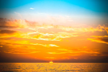 Fototapeta premium Sea waves on the background of beautiful sunset. Toned