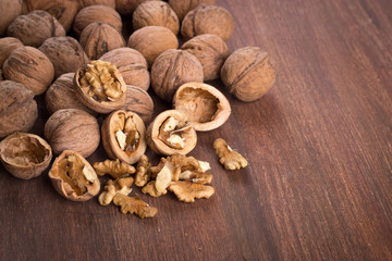 Walnuts whole in their skins, chopped, nut hulls, walnut kernels