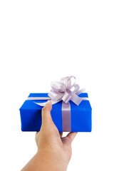 Asian hand gesture giving a gift wrapped in blue box with silver ribbon and bow in a first person view. the most beautiful gift isolated on white background