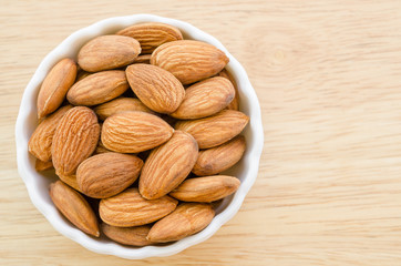 Almonds in white cup.