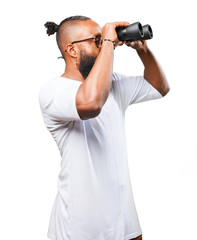 black man looking through a binoculars