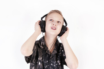 Teenager listening music with headphones, isolated on pure white.