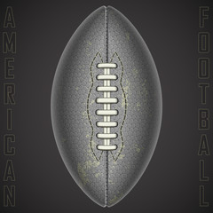 American football ball on a black background.