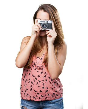 young woman holding a vintage camera
