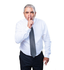 mature man doing a silence gesture