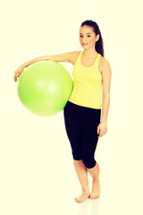 Young woman with pilates ball.