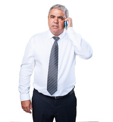 mature man holding a mobile