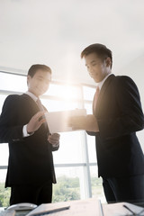 Businessmen with digital tablet