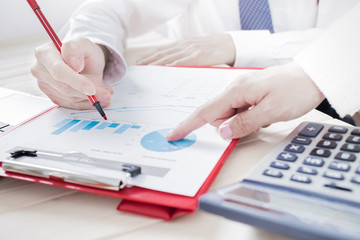 Business people discussing the charts and graphs showing the res