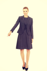 Fototapeta premium Businesswoman pointing down.