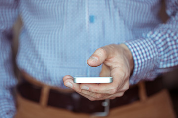 Male hand holding smartphone