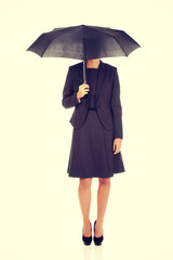 Businesswoman holding an umbrella.