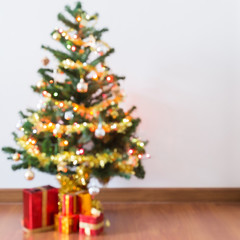 blur background, light celebration on christmas tree with gift box
