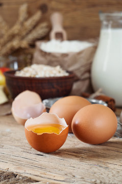 raw half eggs with ingredients for making bakery products